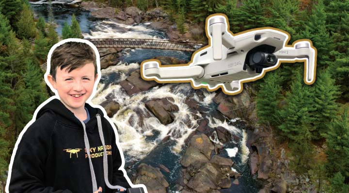 Kid and his drone with a nature backdrop