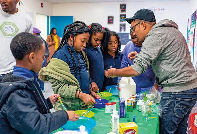 Teacher and students at a STEM workshop