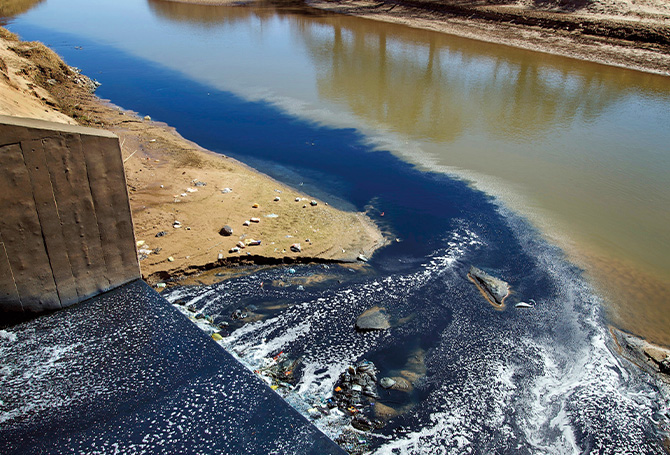 Photo of blue jean dye traveling into a river