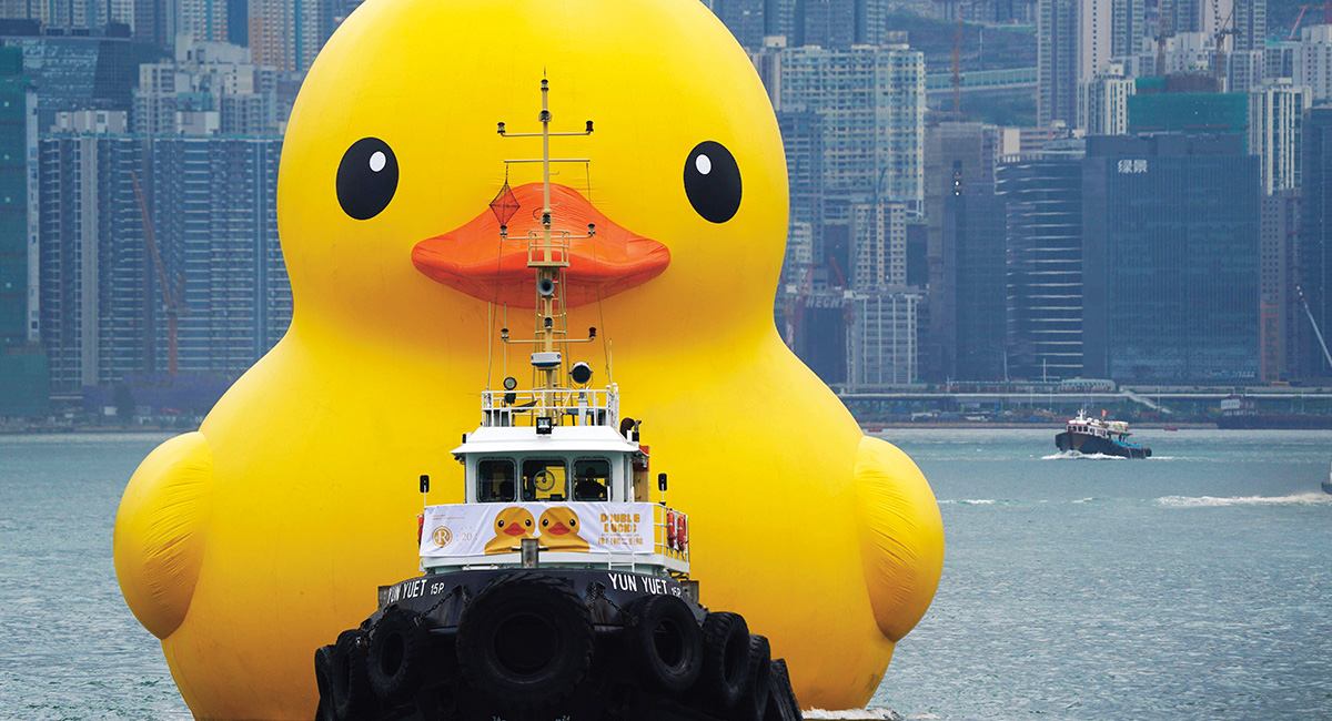 Image of a boat shaped like a giant yellow duck