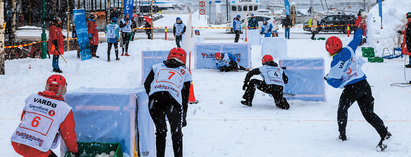 Image of people having a giant snowball fight
